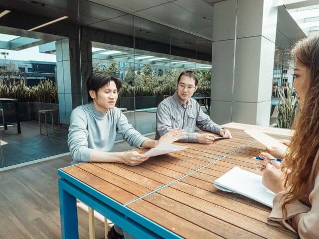 Professionals reviewing legal documents during a working meeting
